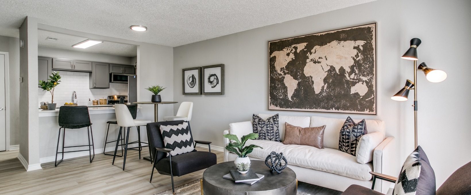 a living room with a couch, coffee table and a large map at The  Holden
