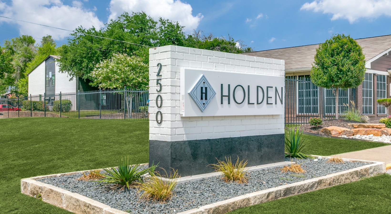 the sign for holden apartments in austin, texas at The  Holden